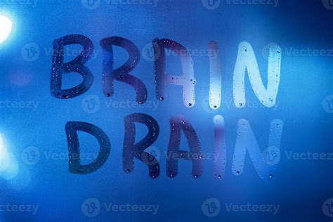 The Words Brain Drain Written On Night Wet Window Glass Close Up With