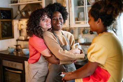 Multiethnic Homosexual Female Lesbian Couple With Daughter Spending Time Together At Home Stock