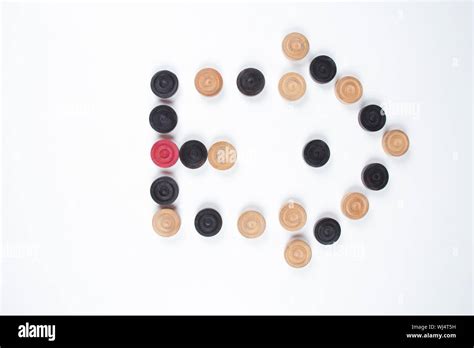 Carrom Pieces In Shape Of Arrow Sign Stock Photo Alamy