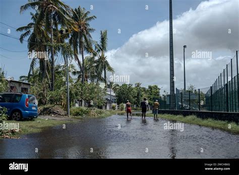 Men Walk On A Submerged Street In The Town Of Saint Paul On The French