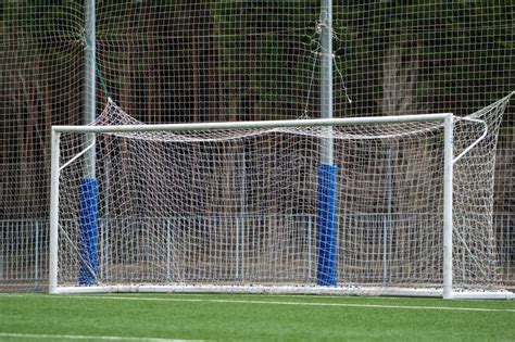 Football Soccer Pitch And A Cloudy Sky Green Field Stock Photo