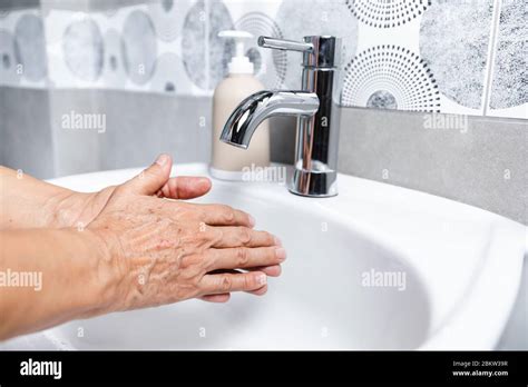 Person Washing Hands With Liquid Soap Lots Of Foam Stock Photo Alamy