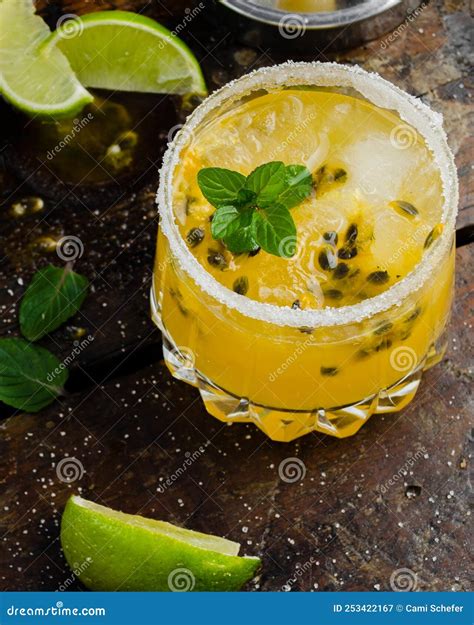 Fresh And Tropical Cocktail With Passion Fruit Lime Mint And Ice