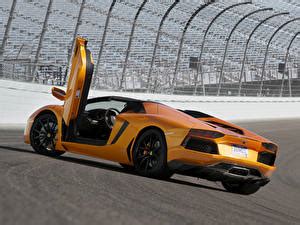 壁紙ランボルギーニAventador LP700 4 Roadsterオレンジ色豪華なロードスター開いたドア自動車ダウンロード写真