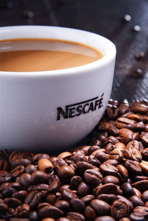 Composition With Cup Of Nescafe Coffee Beans Editorial Stock Photo