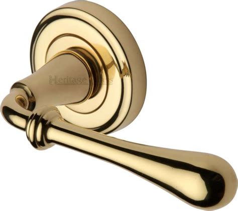 Heritage Roma Round Rose Door Handles V7155 Polished Brass Lacq Broughtons Lighting And Ironmongery