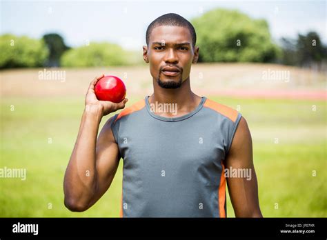 Male Athlete Holding Shot Put Ball Stock Photo Alamy