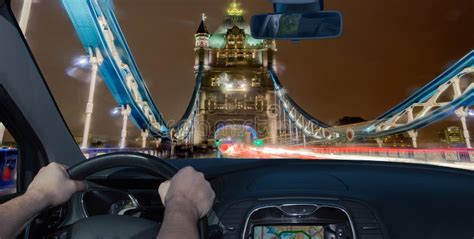 Driving A Car Towards Tower Bridge At Night London Uk Stock Image