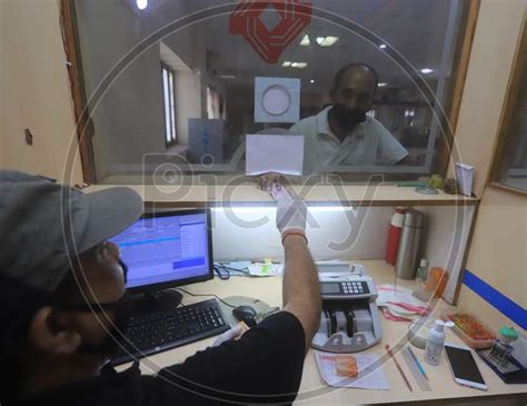 Image Of A Bank Employee Working Inside A Bank During A Day