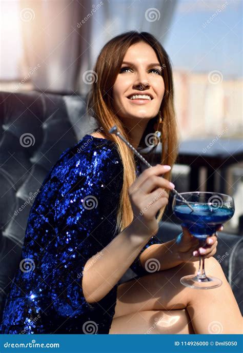 Fashion Brunette Woman Sitting In Expensive Interior Restaurant Drinking Drinking Blue Margarita