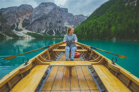 Premium Photo Woman Rowing Boat In Lake