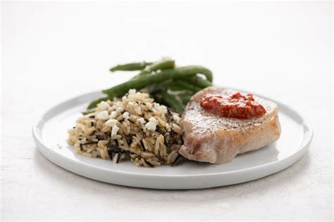 Roasted Red Pepper Pesto Pork Chop With Feta Wild Rice And Green Beans Recipe Home Chef