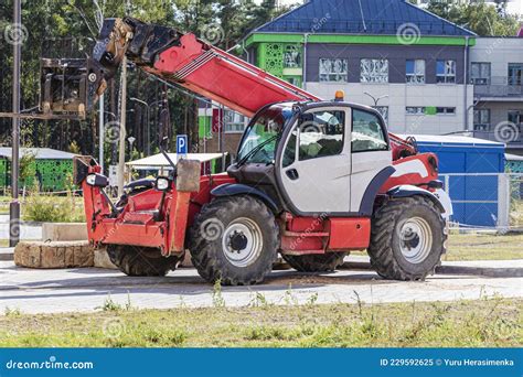 Powerful Wheel Forklift With Telescopic Mast At The Construction Site