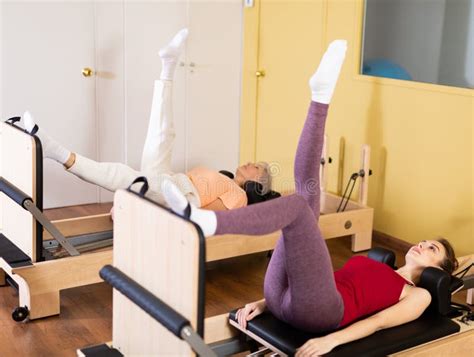 Active Women Perform A Stretching Exercise Stock Photo Image Of