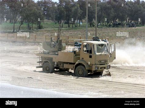 A Destroyed And Abandoned Iraqi Mobile Anti Aircraft Gun Sits Along A