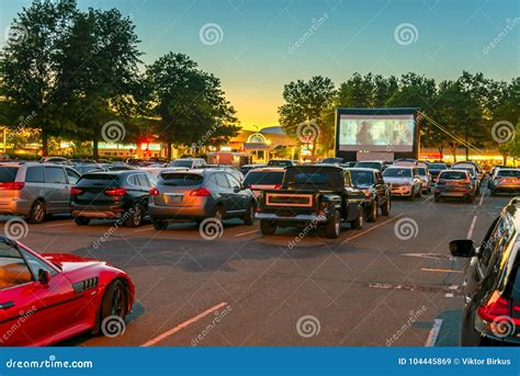 Watching Movies In The Open Air In A Car Park In The City In The Stock