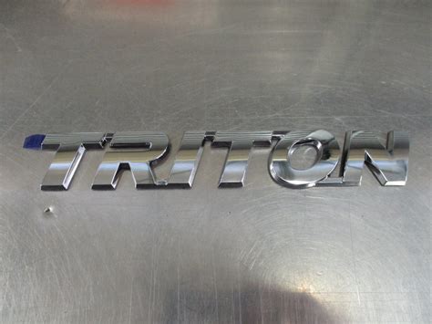 Mitsubishi Triton Genuine Triton Badge New Part Half Price Parts