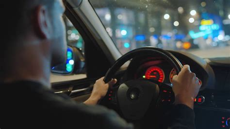 Man Driving Car Through Streets Of Night City Stock Footage Sbv