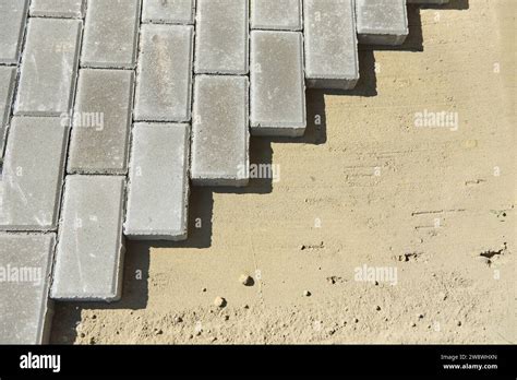 Paving Slabs On Sand During The Construction Process Stock Photo Alamy