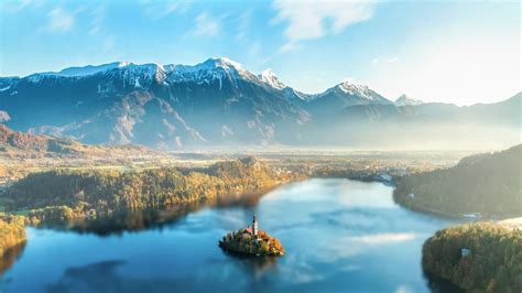 bled slovenia lake mountains mountain the fog sun 4k HD Wallpaper