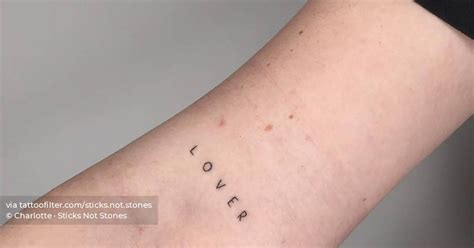 Hand Poked Lettering Tattoo That Says Lover Located