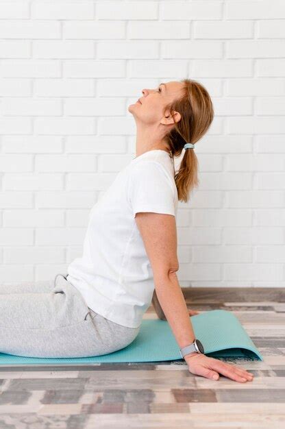 Premium Photo Medium Shot Woman Sitting On Yoga Mat