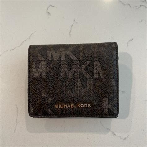 Cute lil Michael Kors monogram wallet / in perfect... - Depop