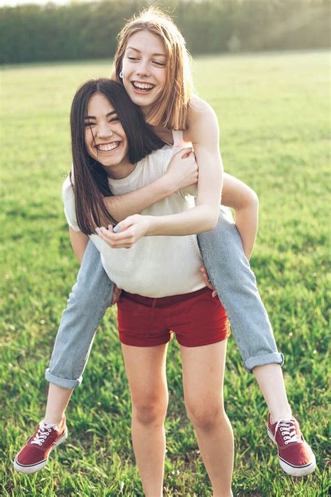 Two Women Having Fun On The Field Stock Photo Image Of Fashion