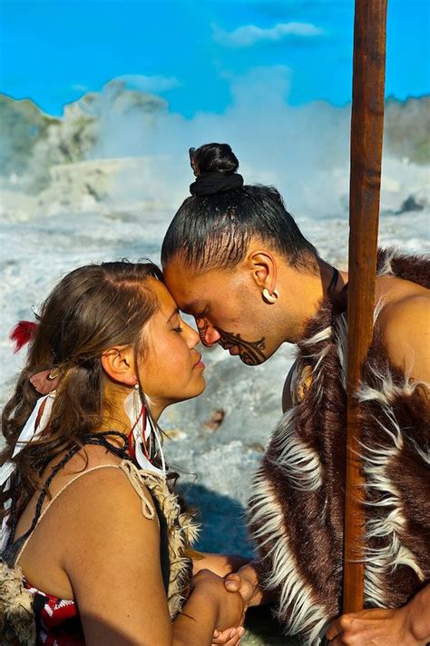 A Maori man with ta moko (facial tattoo) and woman doing hongi ...