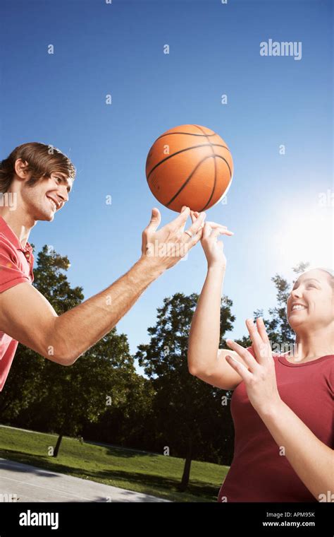 Woman And Man Spinning Basketball On Finger Stock Photo Alamy