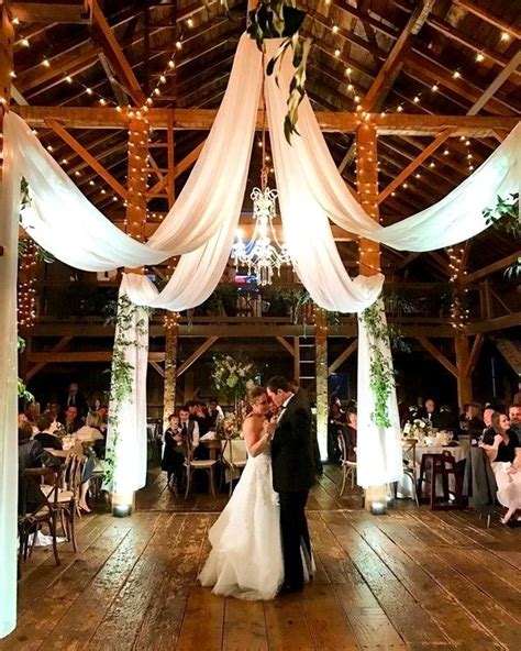 Barn Wedding Reception Suggestions With Draping Material And Lights