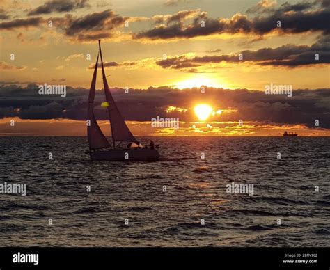 Yacht Sailing Against Sunset Holiday Lifestyle Landscape With Skyline