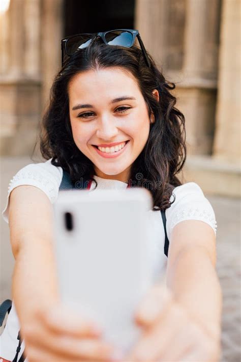 Happy Tourist Woman Taking A Selfie With A Smart Phone Stock Image