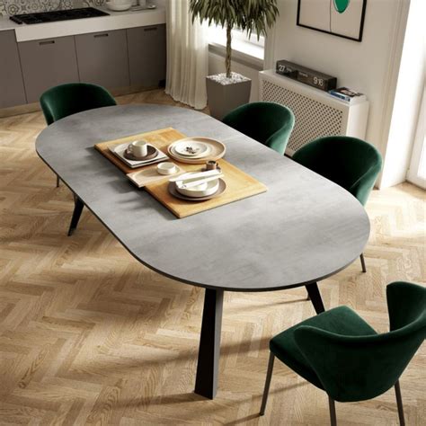 A Table With Green Chairs And Plates On It