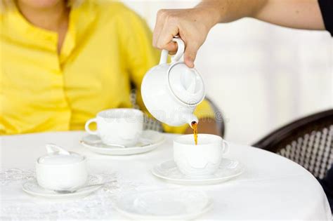 The Man Is Pouring Tea In The Cup Stock Photo Image Of Porcelain