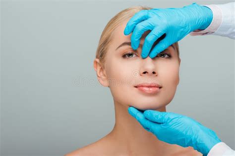 Cropped View Of Beautician In Latex Gloves Touching Nose Of Happy Naked