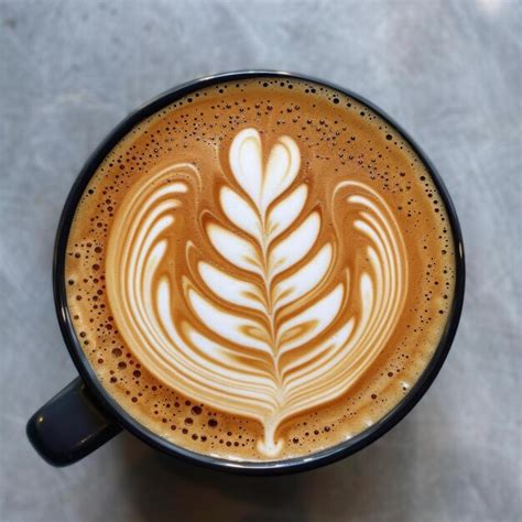 premium photo  cup  latte   leaf