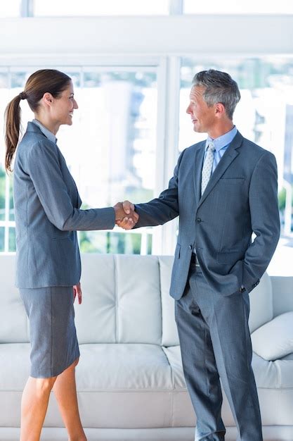 Premium Photo Two Business Workers Shake Hands