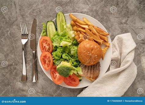 Vegetabes And Fast Food On One Plate Top View Flat Lay Stock Image