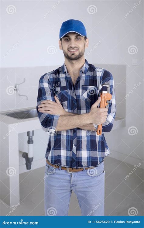 Confident Plumber Standing Near A Kitchen Sink Stock Photo Image Of