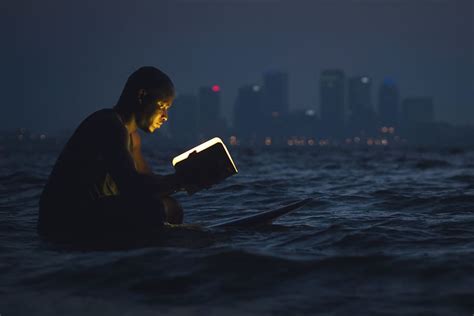 HD Wallpaper Man Reading A Book In The Ocean At Night People Books