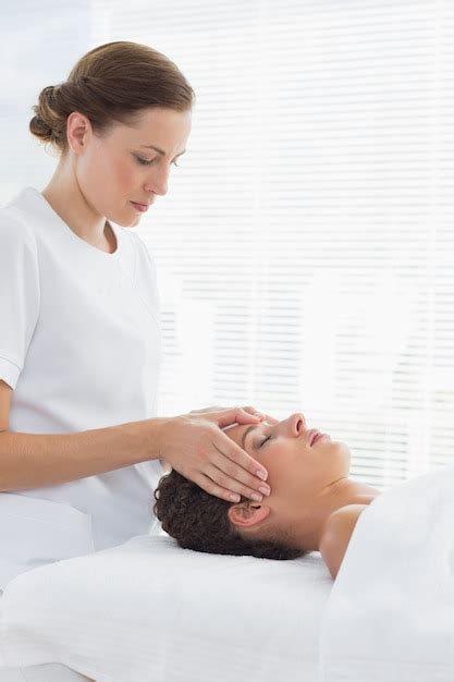 Premium Photo Female Therapist Giving Head Massage To Woman