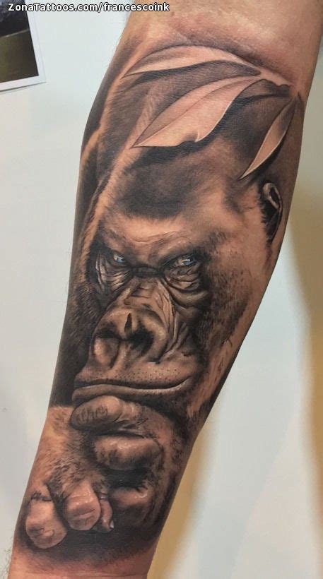 A Man S Arm With A Gorilla Tattoo On It