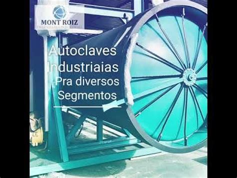 A Large Blue Wheel Sitting On Top Of A Metal Stand Next To A Sign That