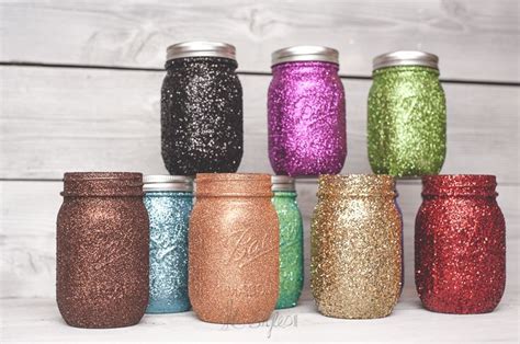 Six Different Colored Glitter Mason Jars Lined Up