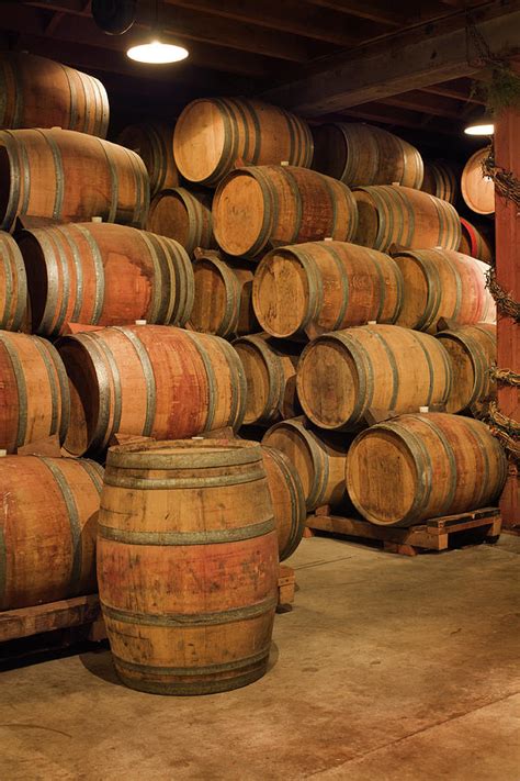 Old Wine Barrels Stacked In Winery Photograph By Yinyang Pixels