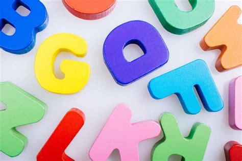 Premium Photo High Angle View Of Multi Colored Alphabets On Table