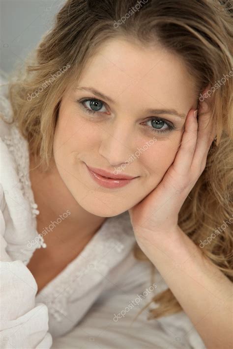 Closeup Of A Natural Blonde Woman With Her Head In Her Hand Stock Photo By Photography