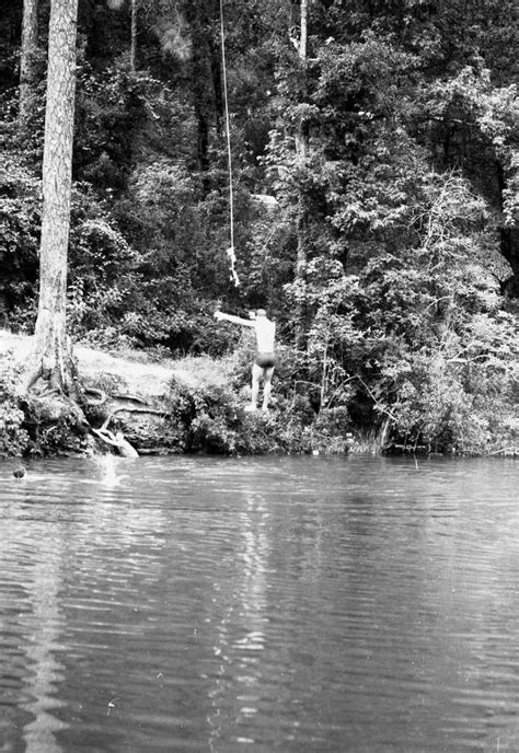 Florida Memory • Child Jumping From A Rope Into The Cherokee Sink