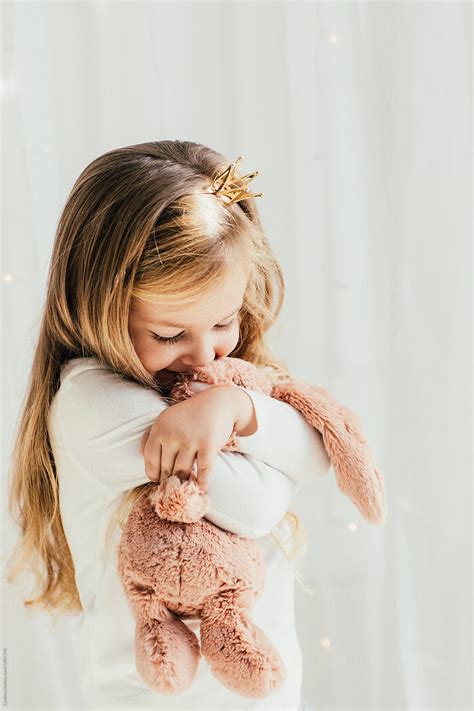 Child Hugging A Toy Del Colaborador De Stocksy Lumina Stocksy